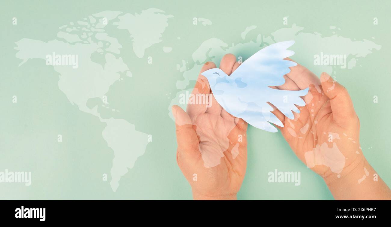 Dove flying from hand international - Dove Flying From Hand International Peace Day Faith Freedom Charity And Help Concept Humanitarian Aid World Map 2X6PHB7 