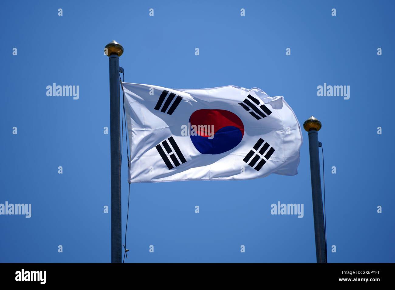 Flag of South Korea waving in the wind against a blue sky. Stock Photo