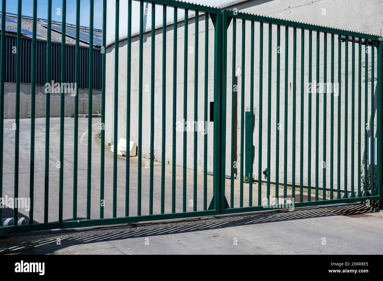 Laeken, Brussels Capital, Belgium May 12, 2024 Metal grid at an industrial gate Stock Photo