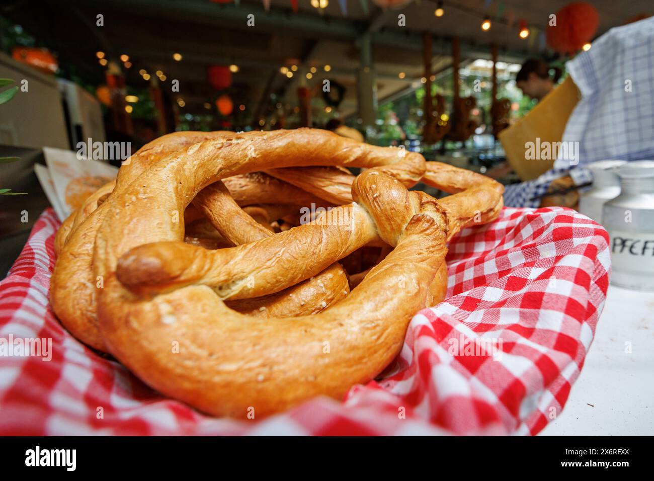 Erlangen, Germany. 16th May, 2024. Large pretzels are on sale at a