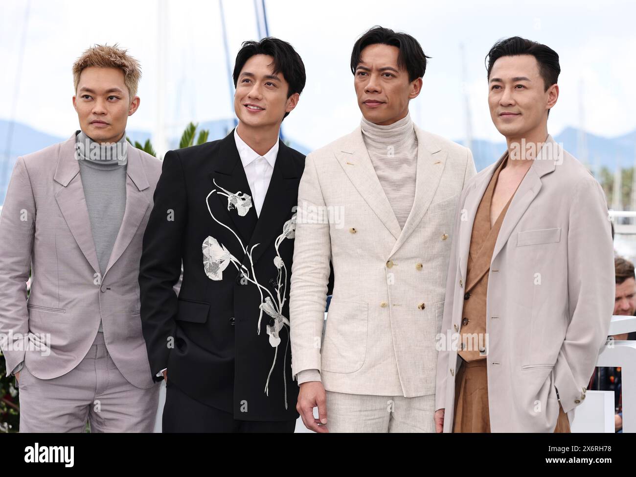 Cannes, France. 16th May, 2024. Actors Tony Wu, Terrance Lau, German Cheung and Raymond Lam (from L to R) pose during a photocall for the film 'Twilight of the Warriors: Walled In' at the 77th edition of the Cannes Film Festival in Cannes, southern France, on May 16, 2024. Credit: Gao Jing/Xinhua/Alamy Live News Stock Photo