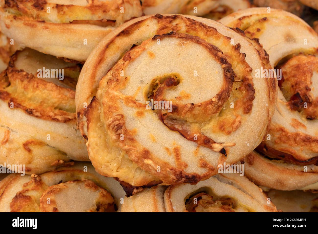 Fresh baked cheese buns of bread close up full frame close up Stock Photo