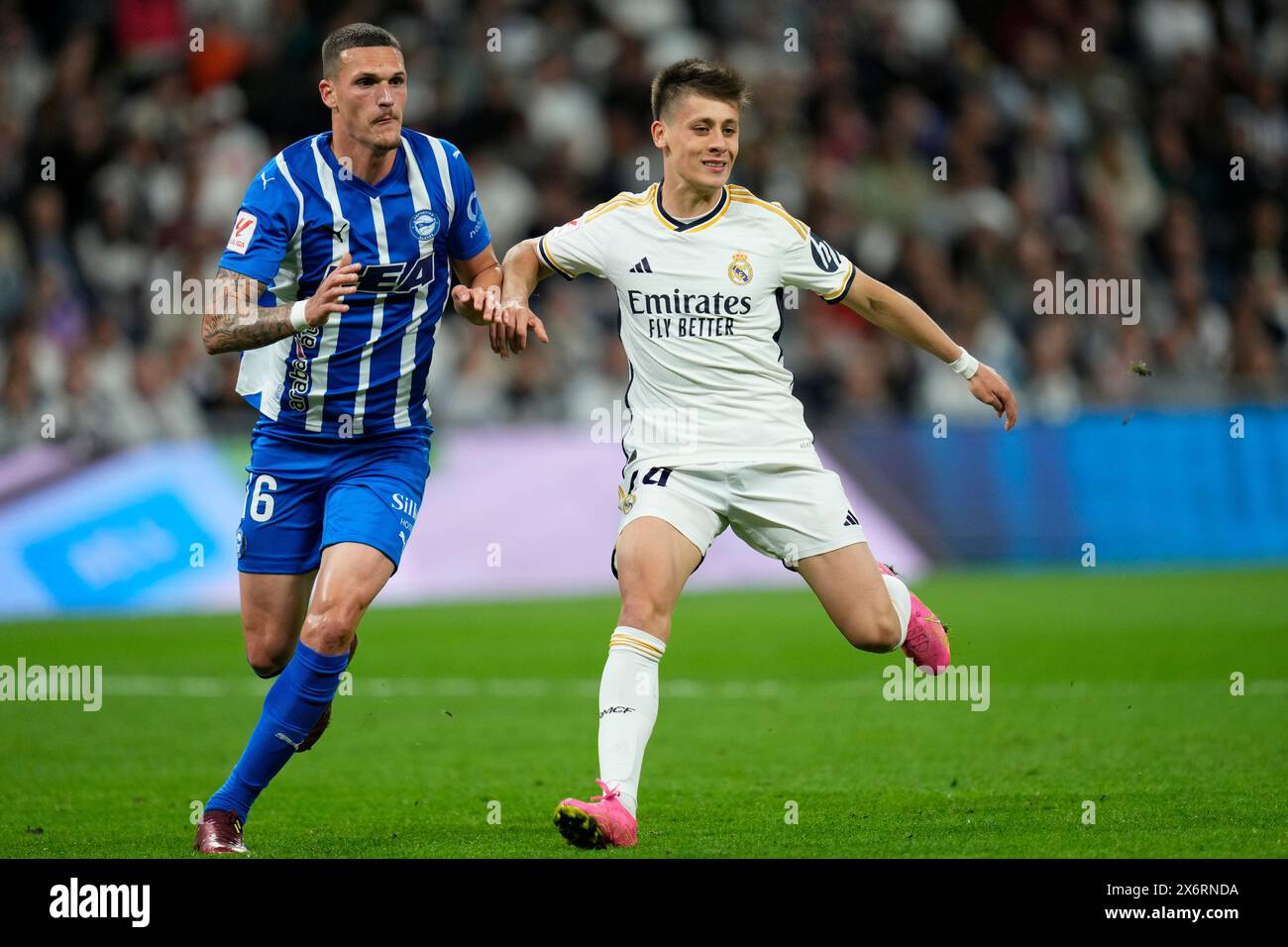Madrid, Spain. 14th May, 2024. Arda Guller of Real Madrid and Rafa Marin of Deportivo Alaves during the La Liga match between Real Madrid and Deportivo Alaves played at Santiago Bernabeu Stadium on May 14, 2024 in Madrid, Spain. (Photo by Cesar Cebolla/PRESSINPHOTO) Credit: PRESSINPHOTO SPORTS AGENCY/Alamy Live News Stock Photo