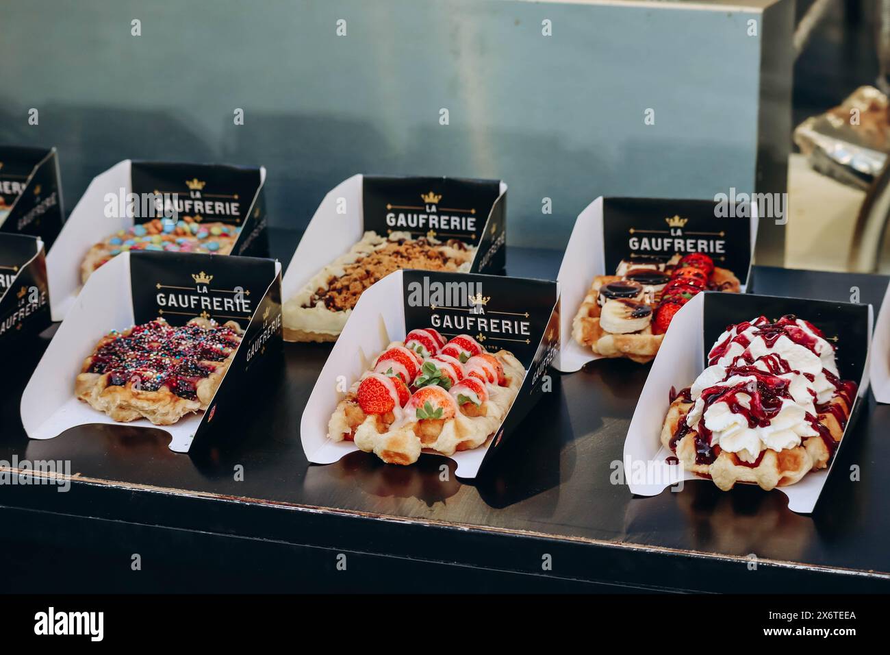 Brussels, Belgium - October 21, 2023: Traditional Belgian waffles with different toppings Stock Photo