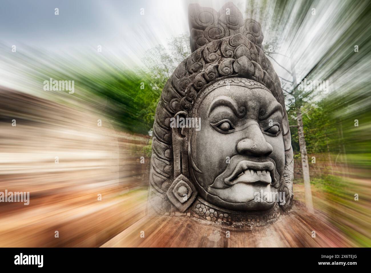 Radial blur of a giant stone head at the South Gate to Angkor Thom. Angkor Archaeological Park, Siem Reap Province, Cambodia. Stock Photo