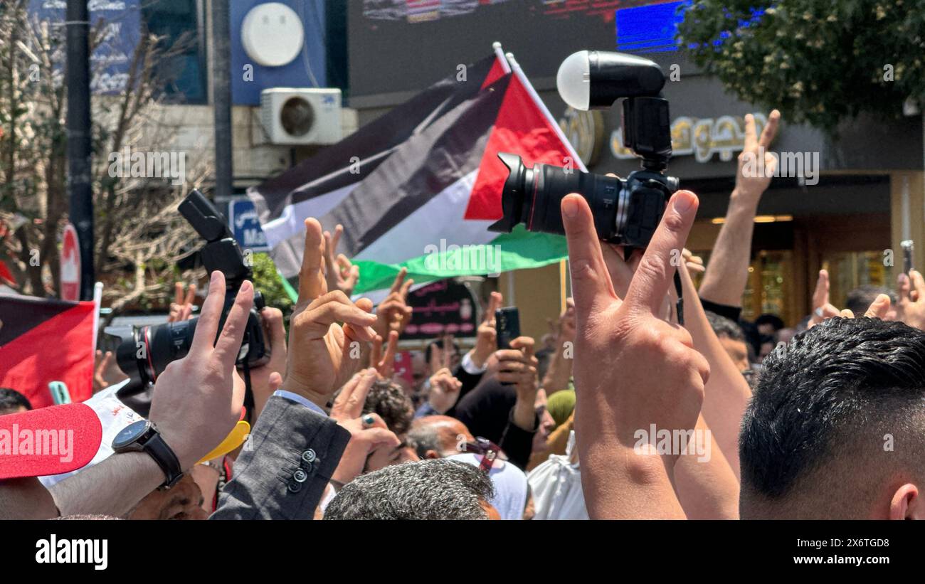 People putting up Palestinian flags march in Ramallah, West Bank on May 15, 2024. A large-scale demonstration is held in the Palestinian autonomous re Stock Photo
