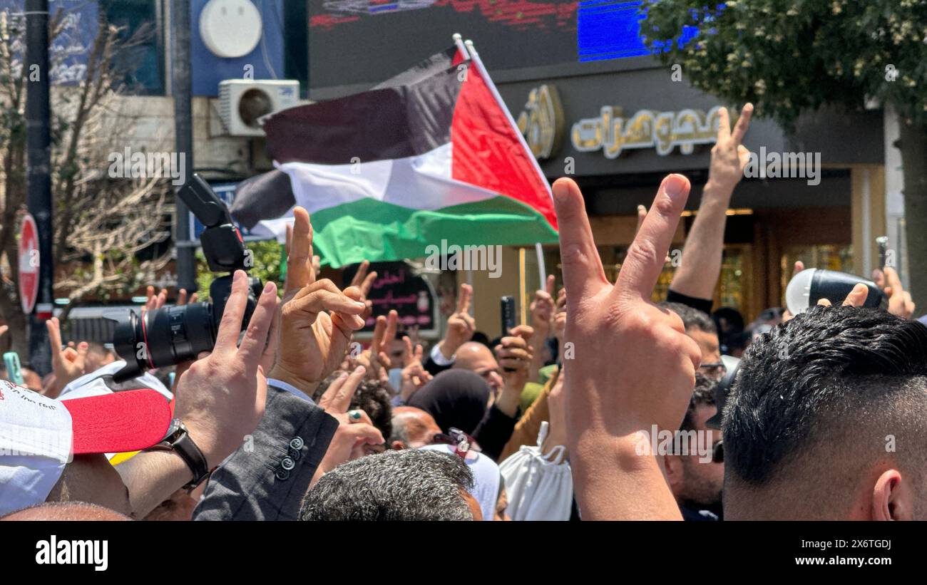 People putting up Palestinian flags march in Ramallah, West Bank on May 15, 2024. A large-scale demonstration is held in the Palestinian autonomous re Stock Photo