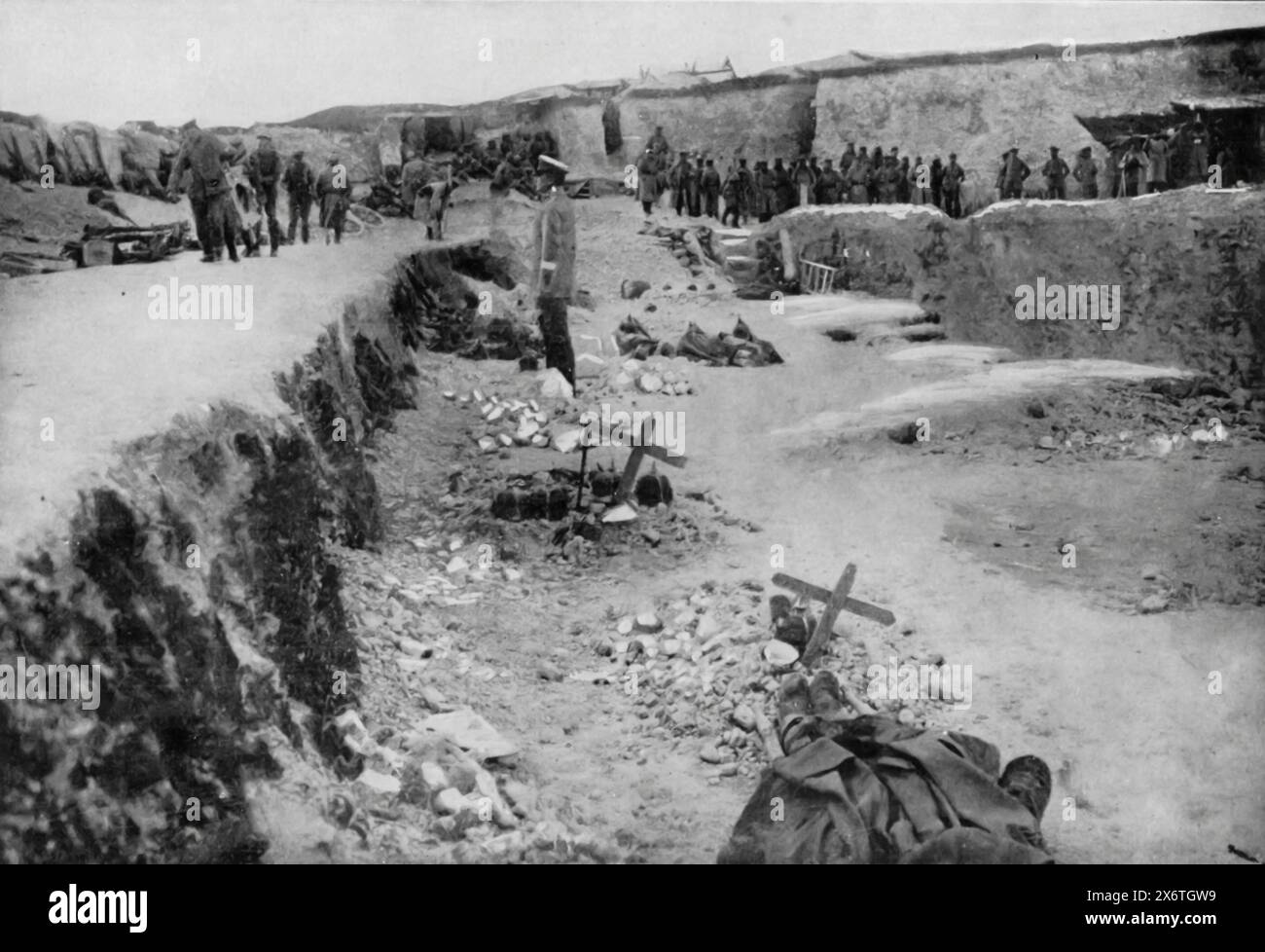 A photograph of a stone quarry near Hulluch, taken shortly after the Battle of Loos and the Allied advance of September 1915. Once considered impregnable due to its strong fortifications, the quarry was a strategic point that was highly contested during the battle. The presence of makeshift grave markers highlights the heavy casualties and the human cost of the First World War. Stock Photo