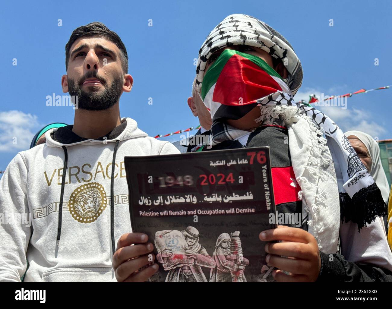 People putting up Palestinian flags march in Ramallah, West Bank on May 15, 2024. A large-scale demonstration is held in the Palestinian autonomous re Stock Photo