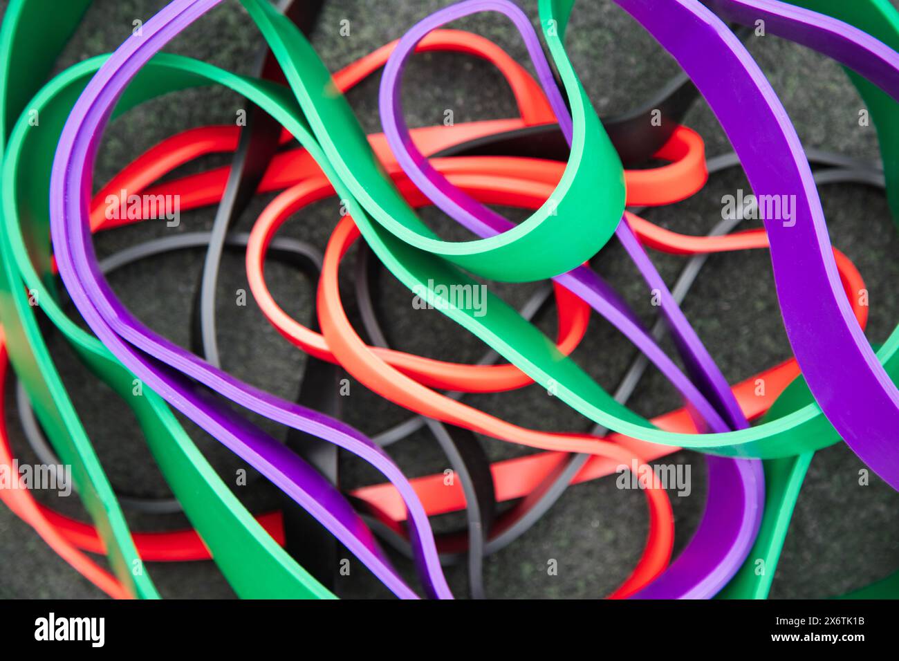 Sports equipment for pumping muscles . Background of colorful rubber