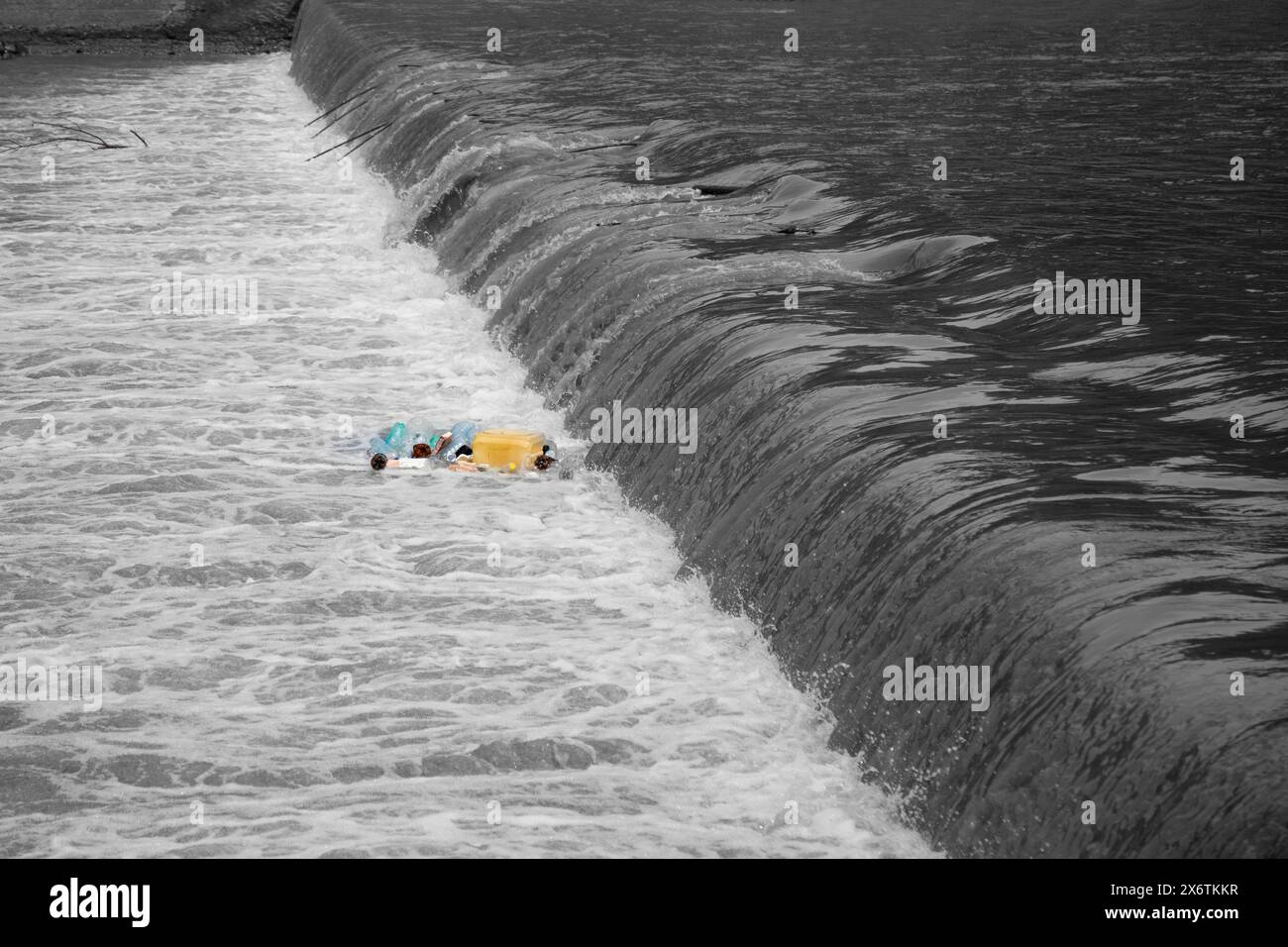 river   polluted with plastic waste. Stock Photo