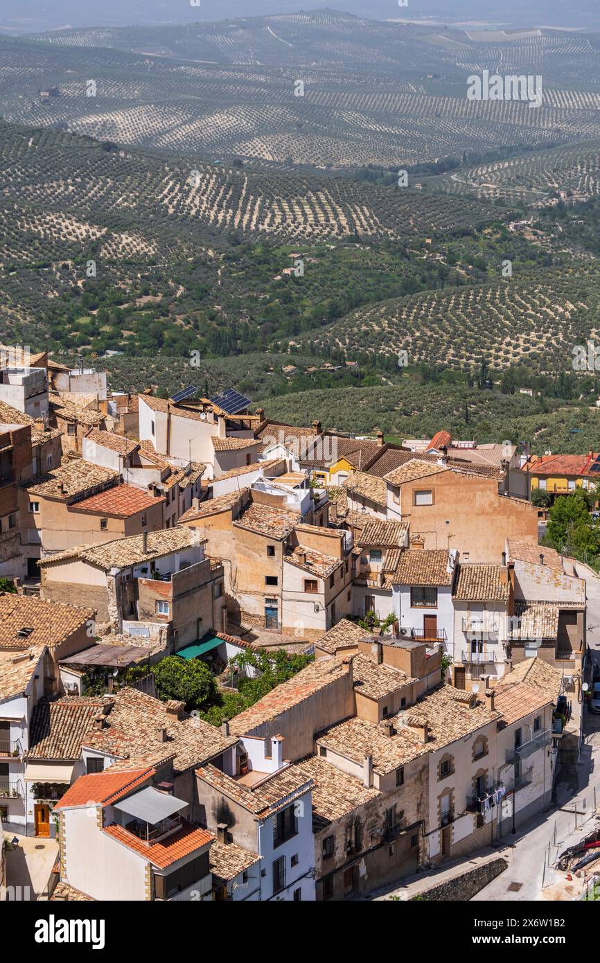 La Iruela houses with a sea of olive trees behind,, Guadalquivir valley, Sierras de Cazorla, Segura and Las Villas N.P., Jaén province, Andalusia, Spain. Stock Photo