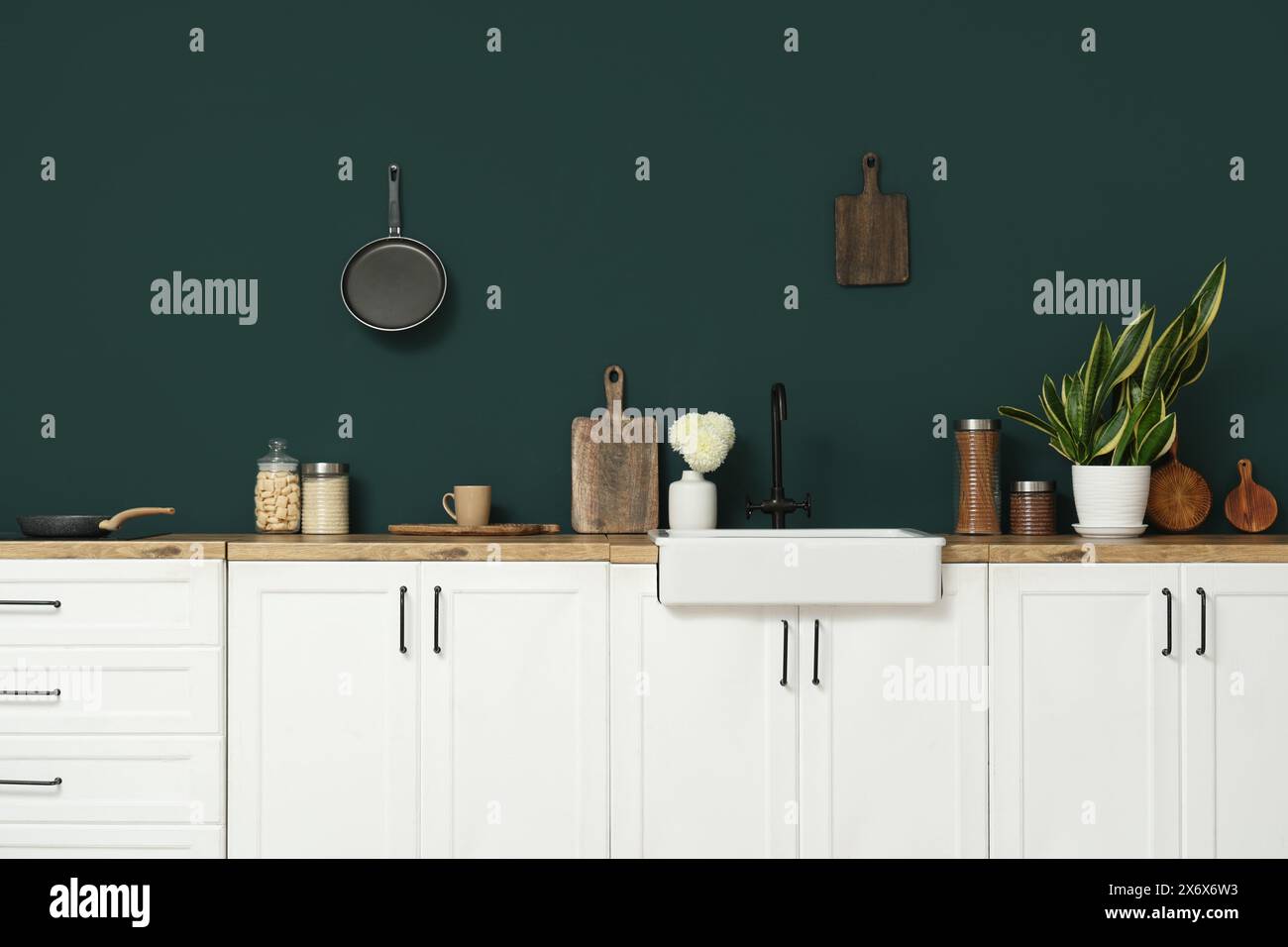 Interior of modern kitchen with white counters, utensils and sink Stock ...