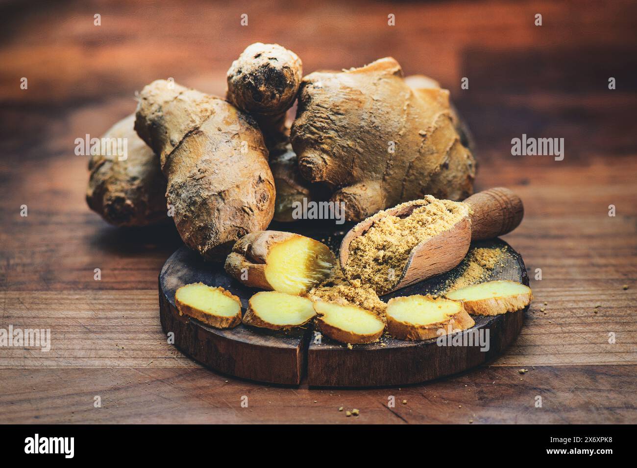 Ginger Root With Powder On Cutting Board Stock Photo