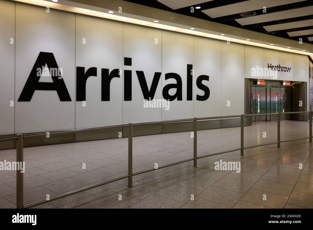 London, UK - March 22, 2024; Empty arrivals hall at London Heathrow airport with large sign and no people Stock Photo