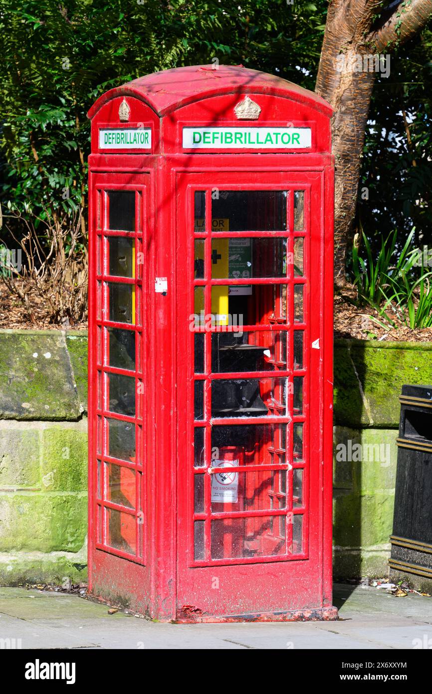 Shrewsbury, UK, - March 19,  2024; Classic  british red telephone box repurposed as defibrillator station kiosk Stock Photo