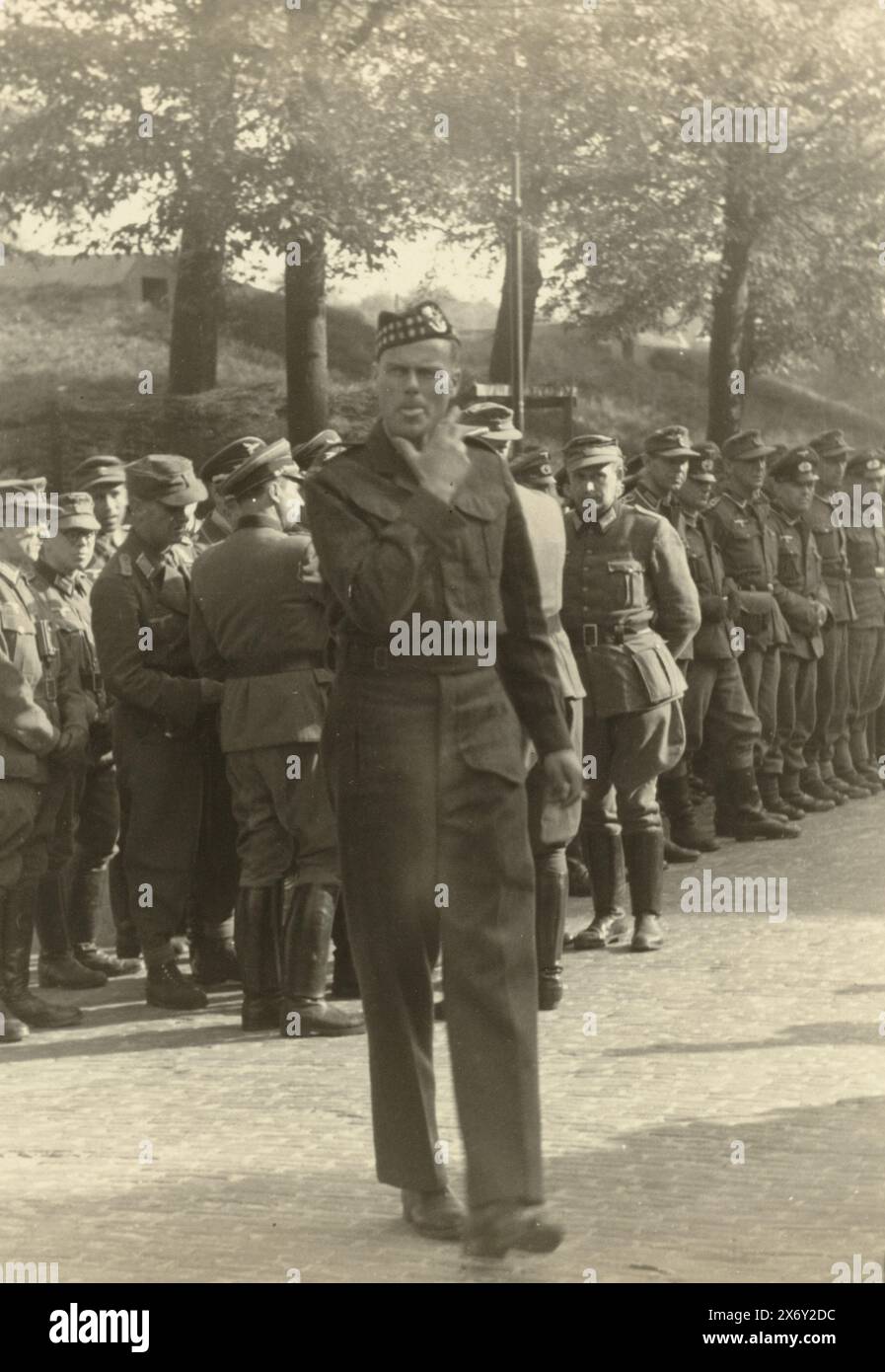 German prisoners of war, German prisoners of war guarded by English? soldiers., photograph, anonymous, Netherlands, May-1945, photographic support, height, 13 cm × width, 17.5 cm Stock Photo