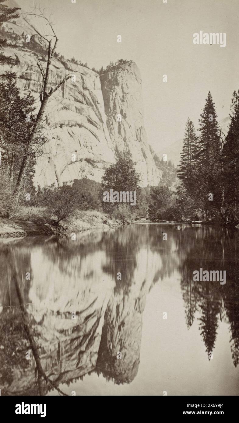 Rock wall reflected in a water in the United States, photograph, George ...