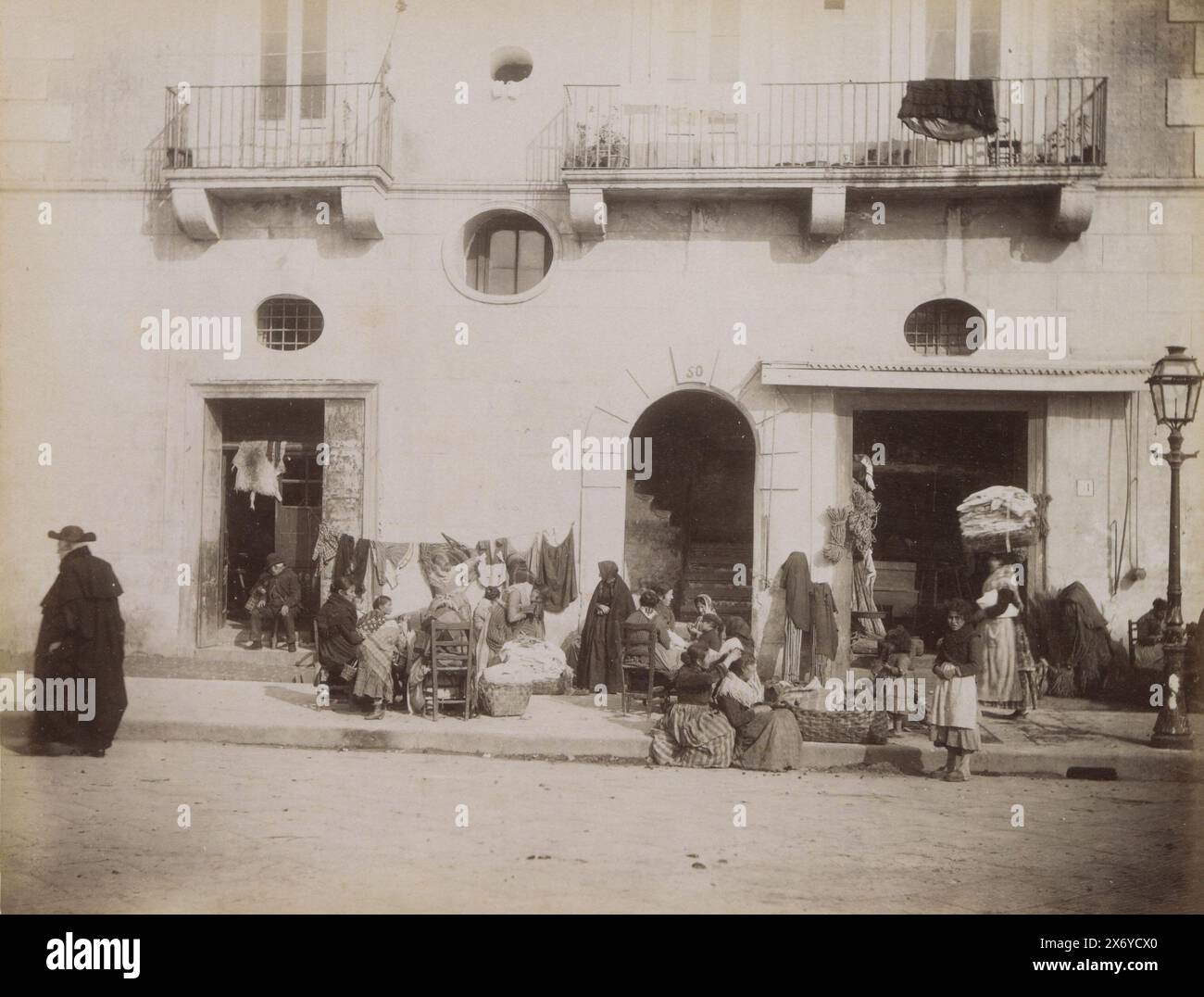 Street view in Italy with women, children and laundry, Custom[(...)] (title on object), Part of Travel album with photos of sights in Italy and on the French Riviera (part II)., photograph, Giorgio Sommer, Italy, c. 1860 - c. 1890, paper, albumen print, height, 192 mm × width, 247 mm Stock Photo