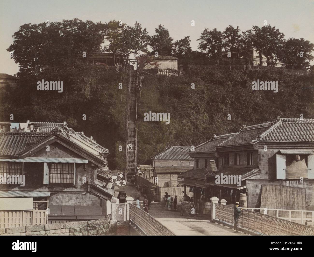 Village street with stairs in Japan, Part of Photo album with 50 photos of sights in Japan., photograph, anonymous, Japan, c. 1870 - c. 1900, paper, albumen print, height, 196 mm × width, 258 mm Stock Photo