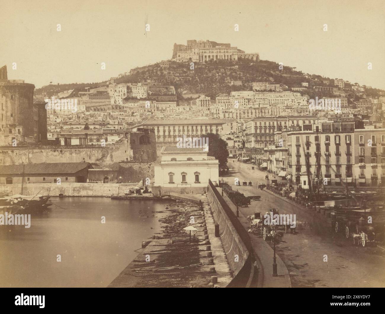 View of the Naples Wharf and the Castel Sant'Elmo, Molo e St. Martino - Napoli (title on object), photograph, Achille Mauri, (mentioned on object), Naples, c. 1851 - c. 1900, paper, albumen print, height, 213 mm × width, 271 mm, height, 223 mm × width, 280 mm Stock Photo