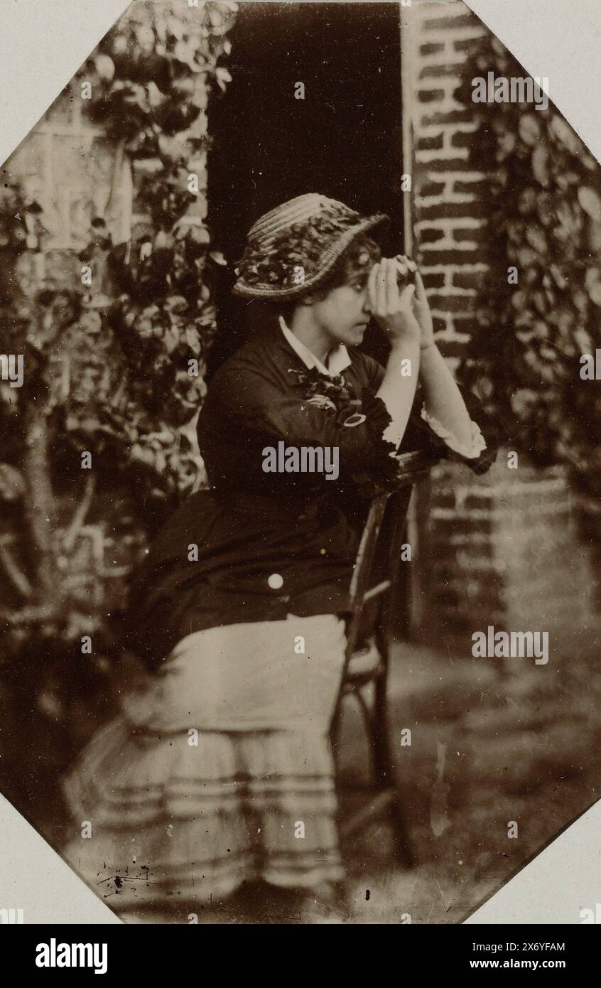 Portrait of an unknown woman on a chair with binoculars, Madame W. Petit -Dallas 1878 (title on object), photograph, anonymous, Normandië, 1878, baryta paper, height, 70 mm × width, 46 mm Stock Photo