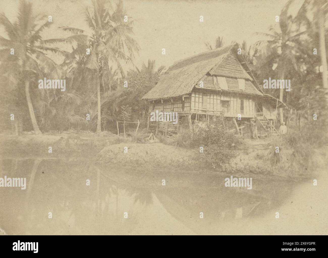 View of a house on the water on Sulawesi, Buginesische Wohnung (Süd Celebes) (title on object), cabinet photograph, anonymous, Sulawesi, 1870 - 1900, paper, albumen print, height, 100 mm × width, 140 mm, height, 106 mm × width, 165 mm Stock Photo