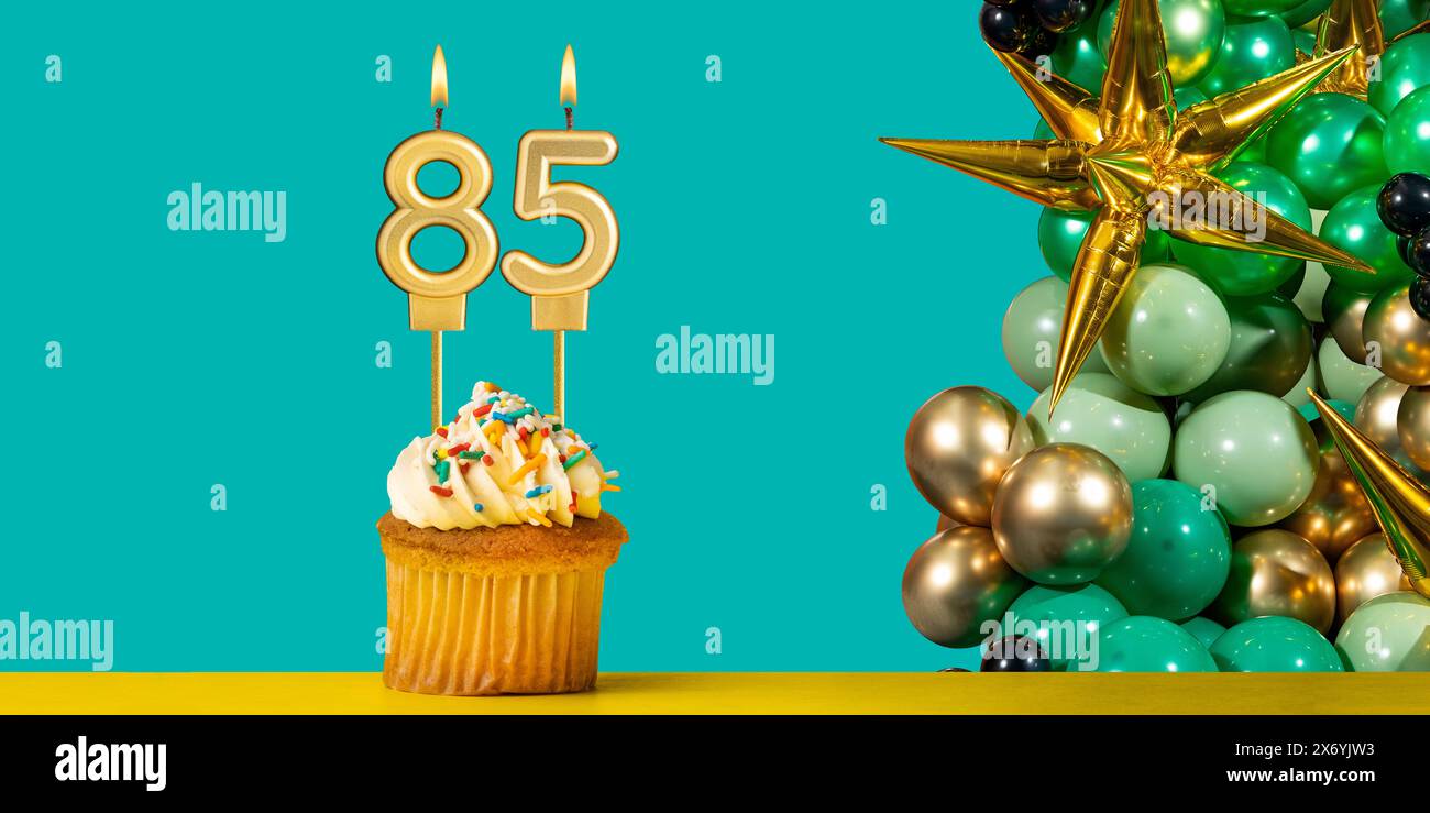 Birthday card number 85 - Cupcake with balloons Stock Photo