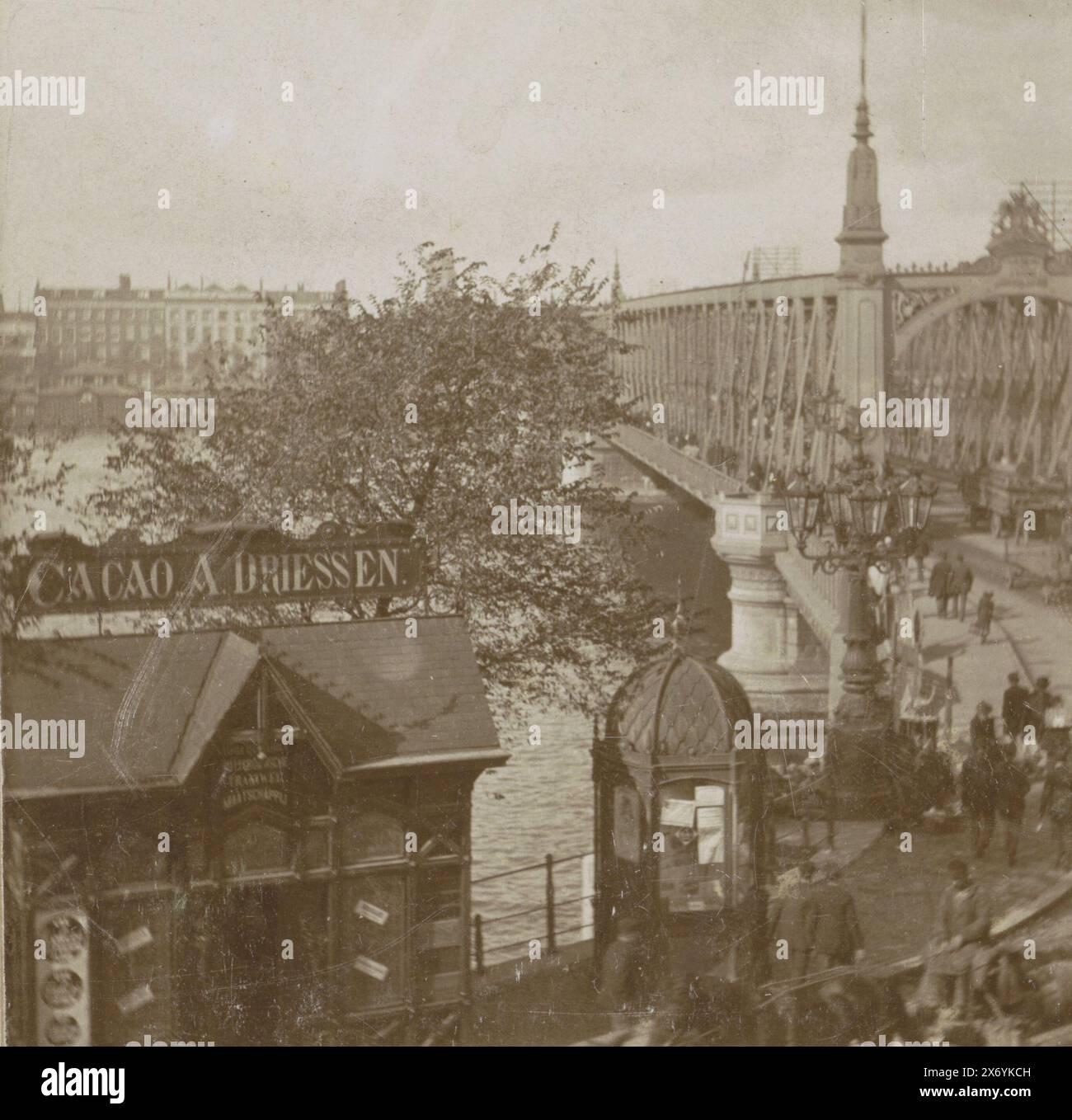 View of the Willemsbrug in Rotterdam, seen from the terrace of Café Fritschy, Rotterdam, view of the Willemsbrug (from the terrace of Café Fritschy) (title on object), stereograph, anonymous, Rotterdam, 1890 - 1900, cardboard, height, 88 mm × width, 178 mm Stock Photo