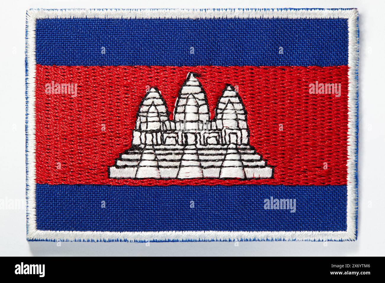 Cambodian national flag embroidered emblem with 2 blue lines at the top and bottom, 1 red area in the middle containing a picture of the Angkor Wat Stock Photo