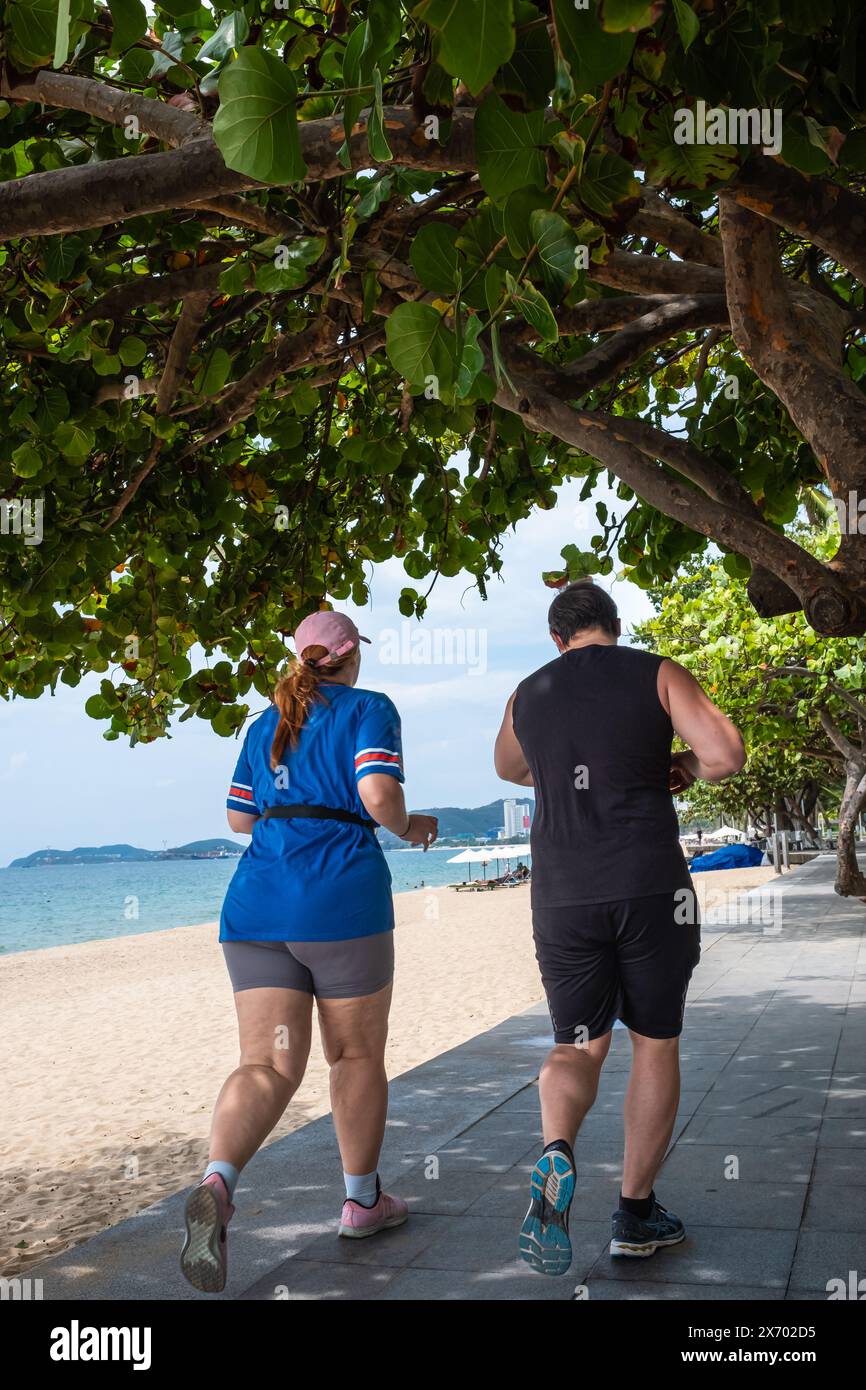 Overweight couple working out together. Husband, wife working on weight
