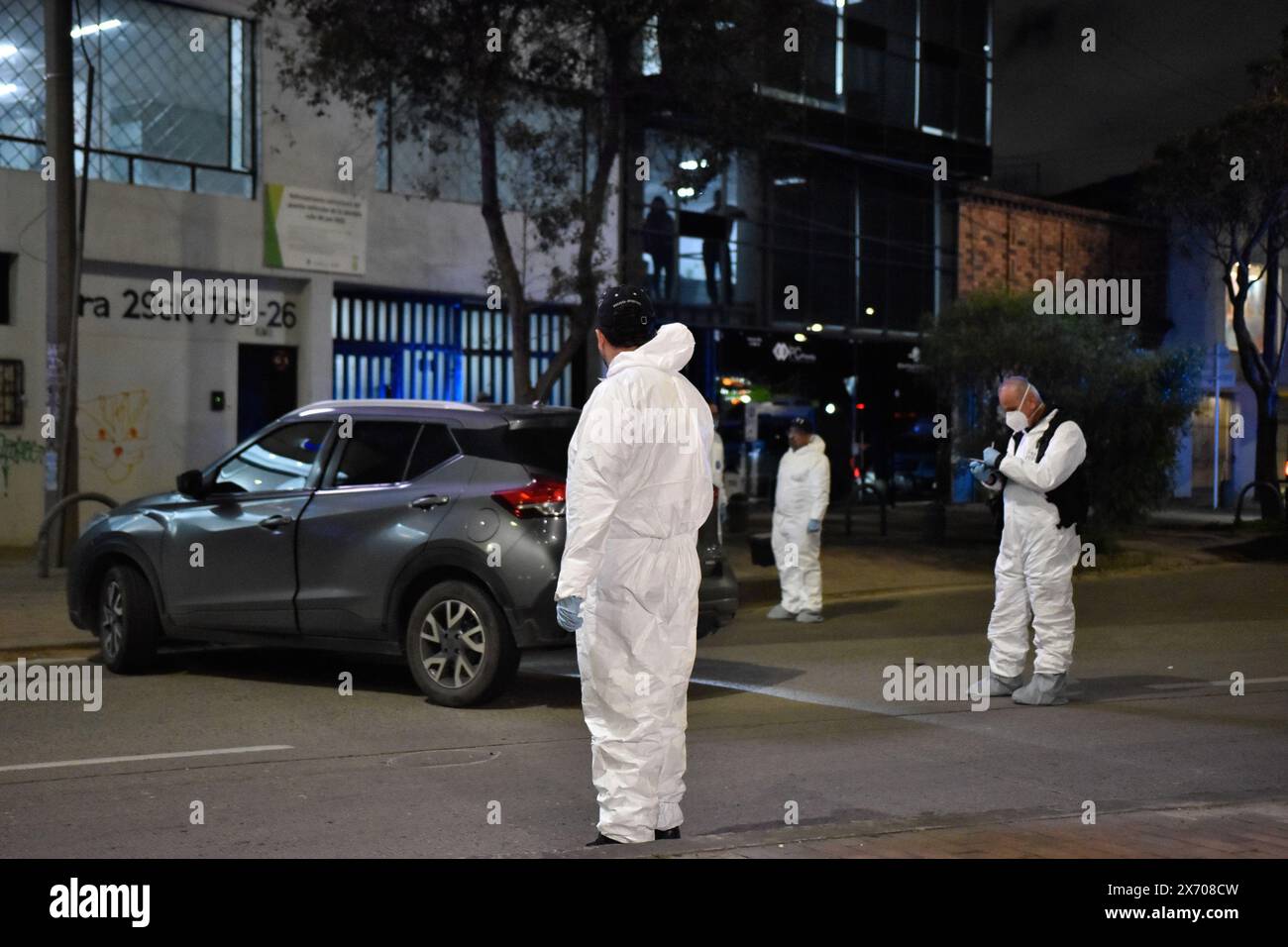 Bogota, Colombia. 16th May, 2024. Forensic workers and police officers inspect the crime scene where the Director of La Modelo prison Elmer Fernandez was murdered in Bogota on May 16, 2024. Elmer Fernandez a retires police colonel was shot dead Thursday in Bogota after receiving several death threats, the government said. Photo by: Cristian Bayona/Long Visual Press Credit: Long Visual Press/Alamy Live News Stock Photo