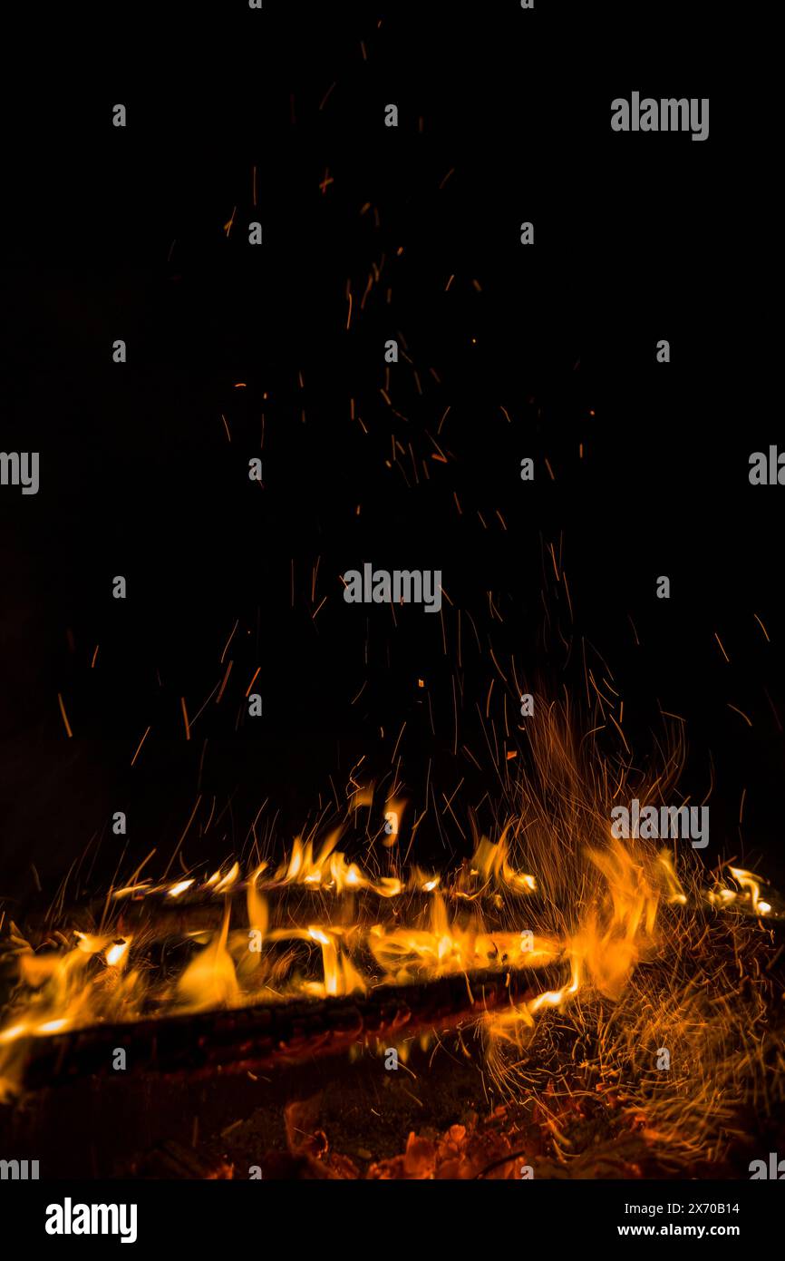 fire flames with sparks on a black background Stock Photo