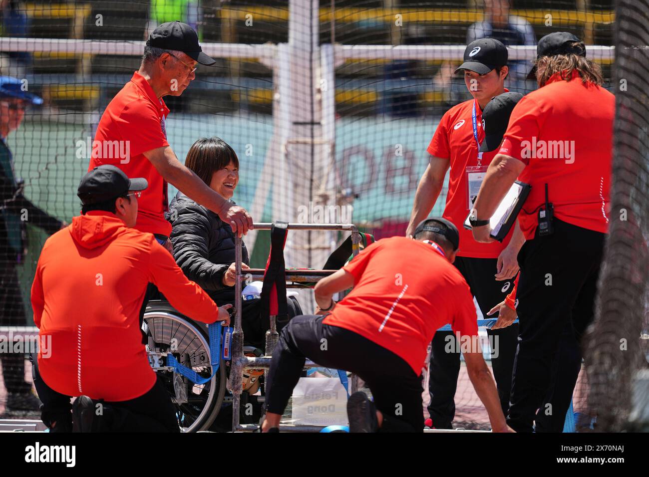 Kobe, Japan. 17th May, 2024. Staff members adjust the wheelchair for