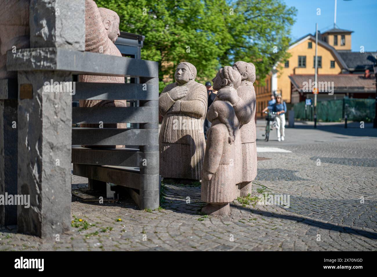 Skvallertorget or Gossip square with a granite sculpture by Pye Engström in Norrköping during spring in Sweden. Stock Photo