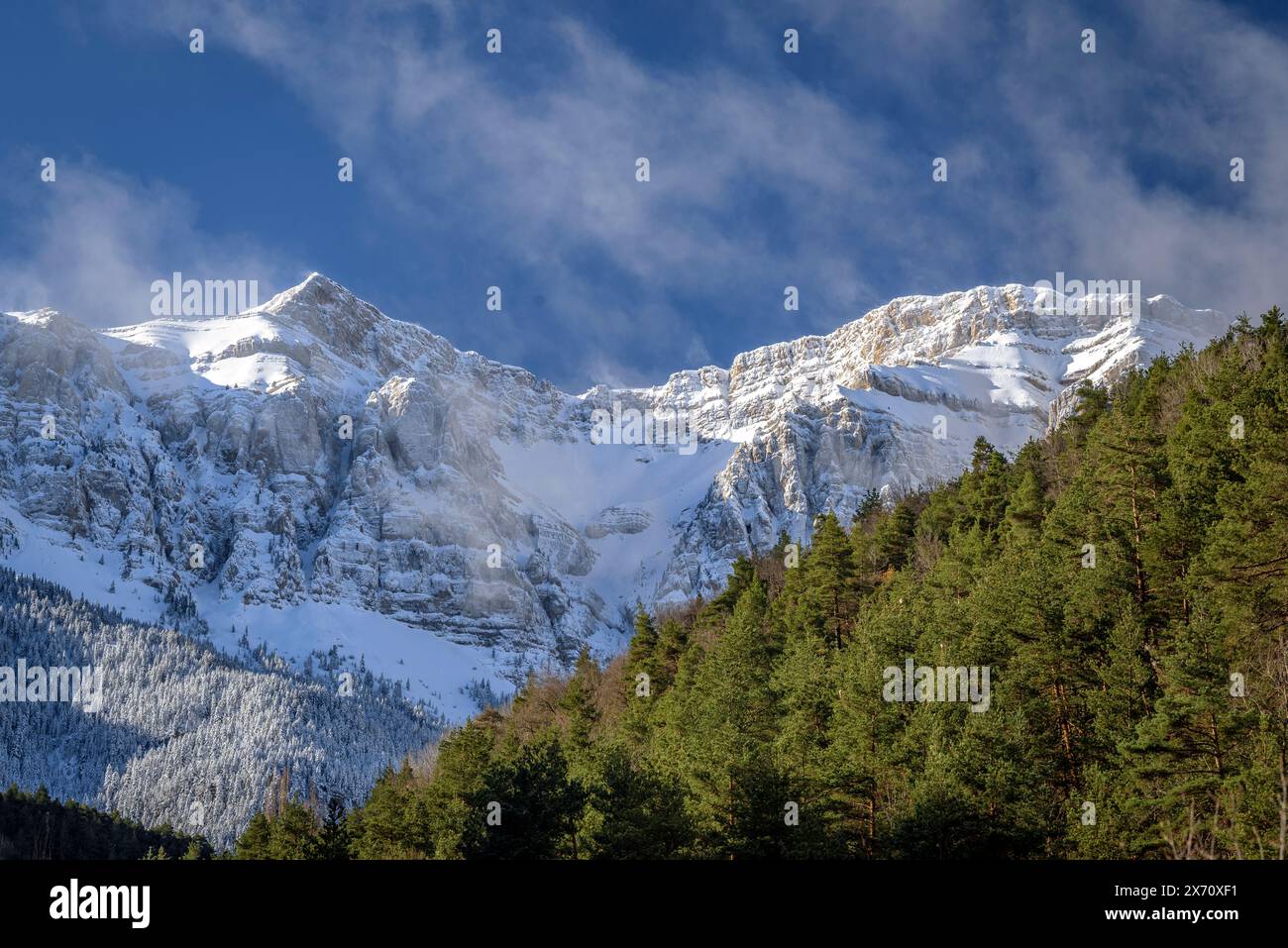 Snowy Serra del Cadí and Costa Cabirolera summit between clouds and fog