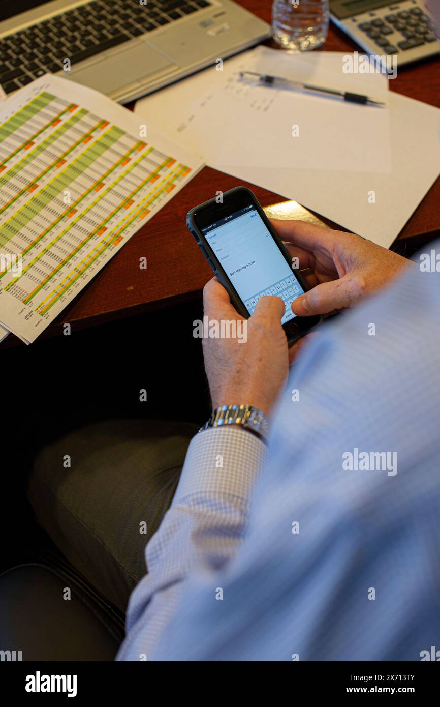 Hand of businessman using smartphone for email Stock Photo