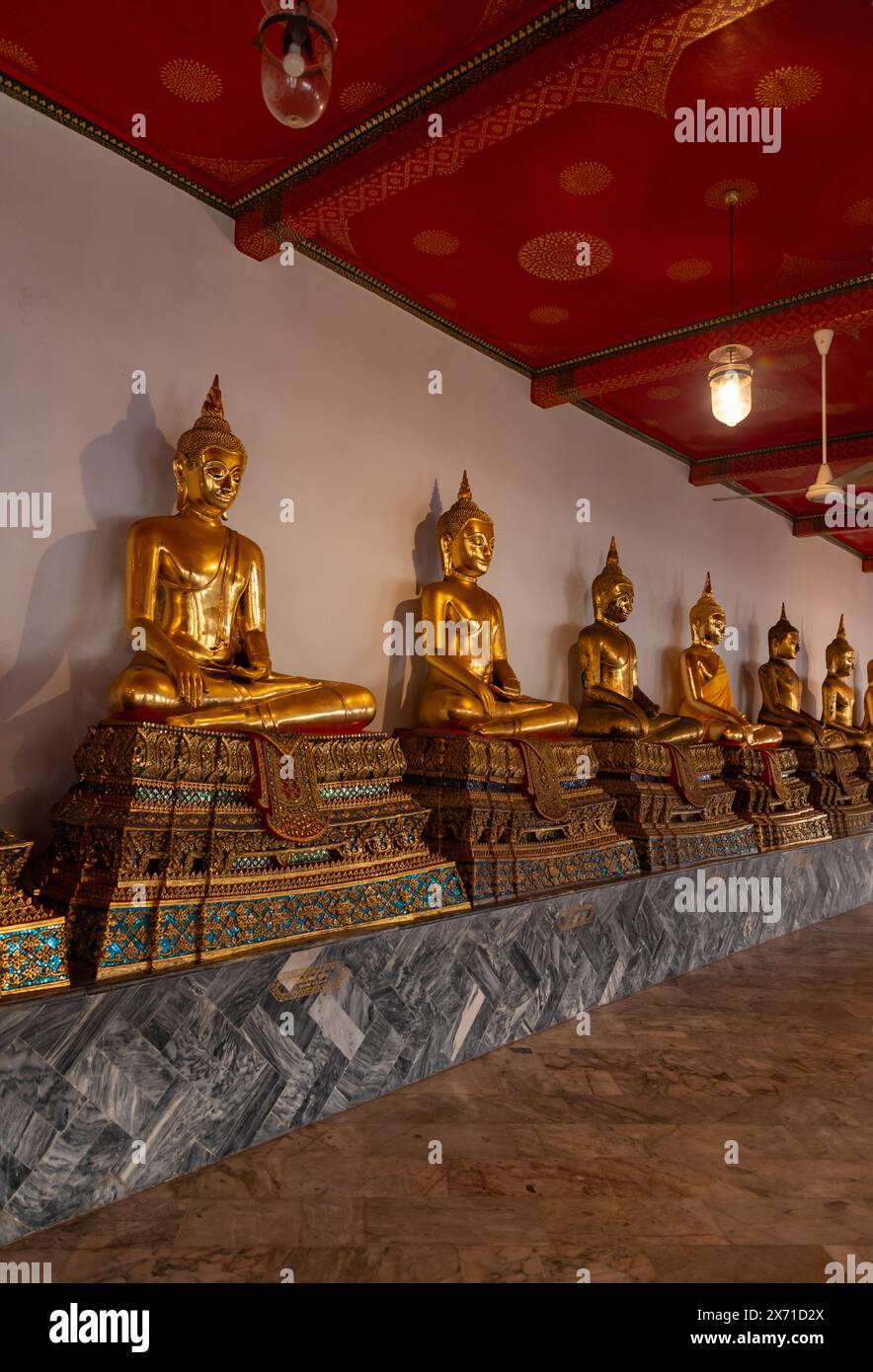 A picture of golden Buddha statues at the Wat Pho Temple Stock Photo ...