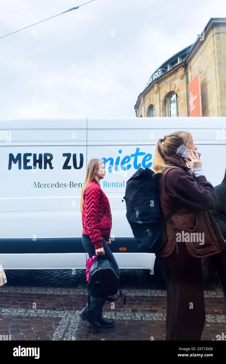  Freiburg, Germany - Mar 5, 2024: A woman walks near the Theater 