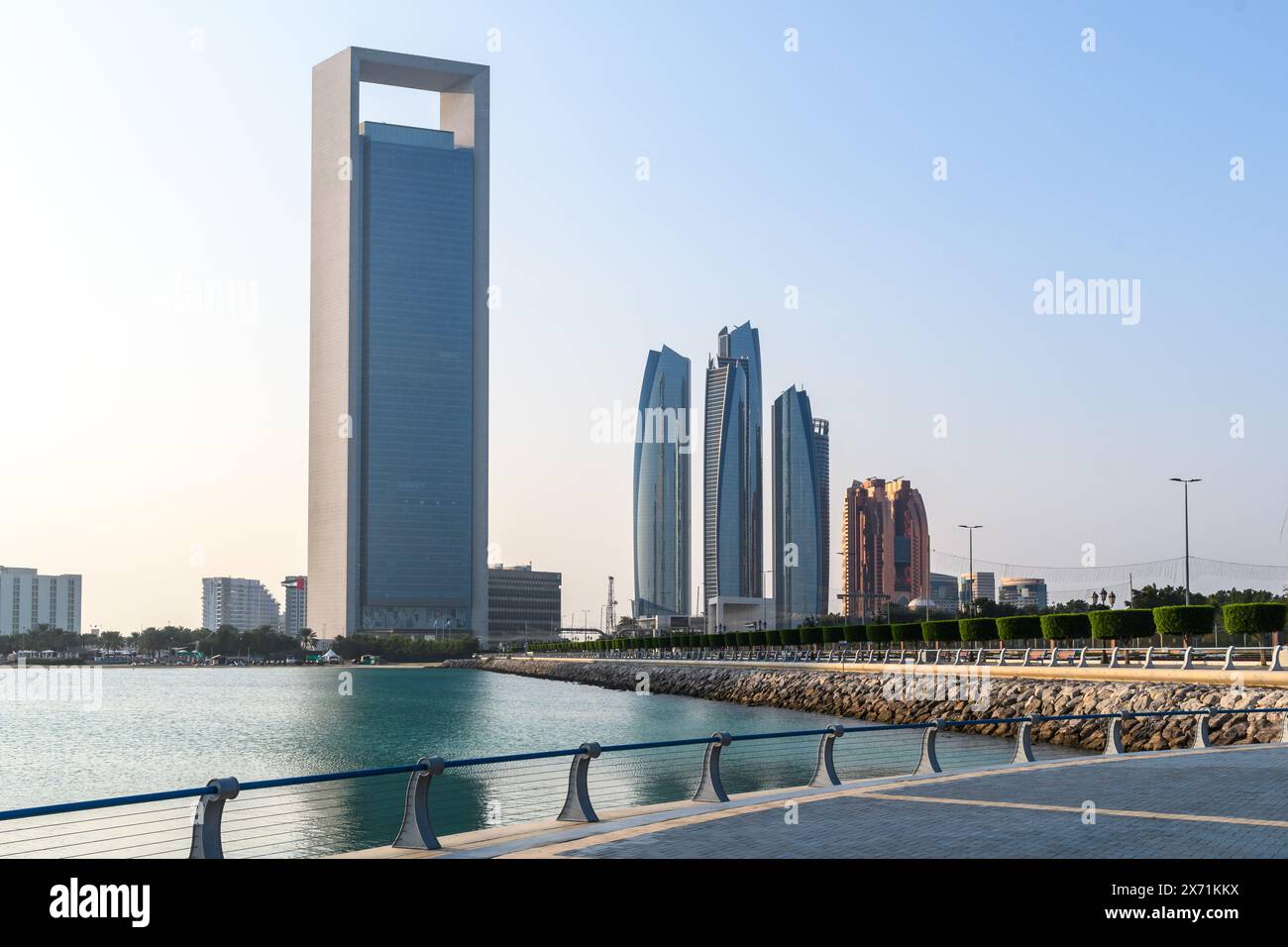 Abu Dhabi, UAE - January 4, 2024: Abu Dhabi’s skyline showcases architectural innovation against the tranquil waters of the city’s waterfront. Stock Photo