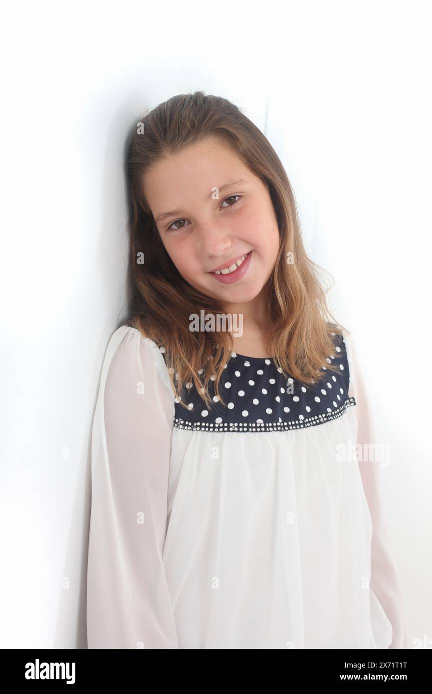 portrait of a cheerful preteen girl on white background Stock Photo - Alamy