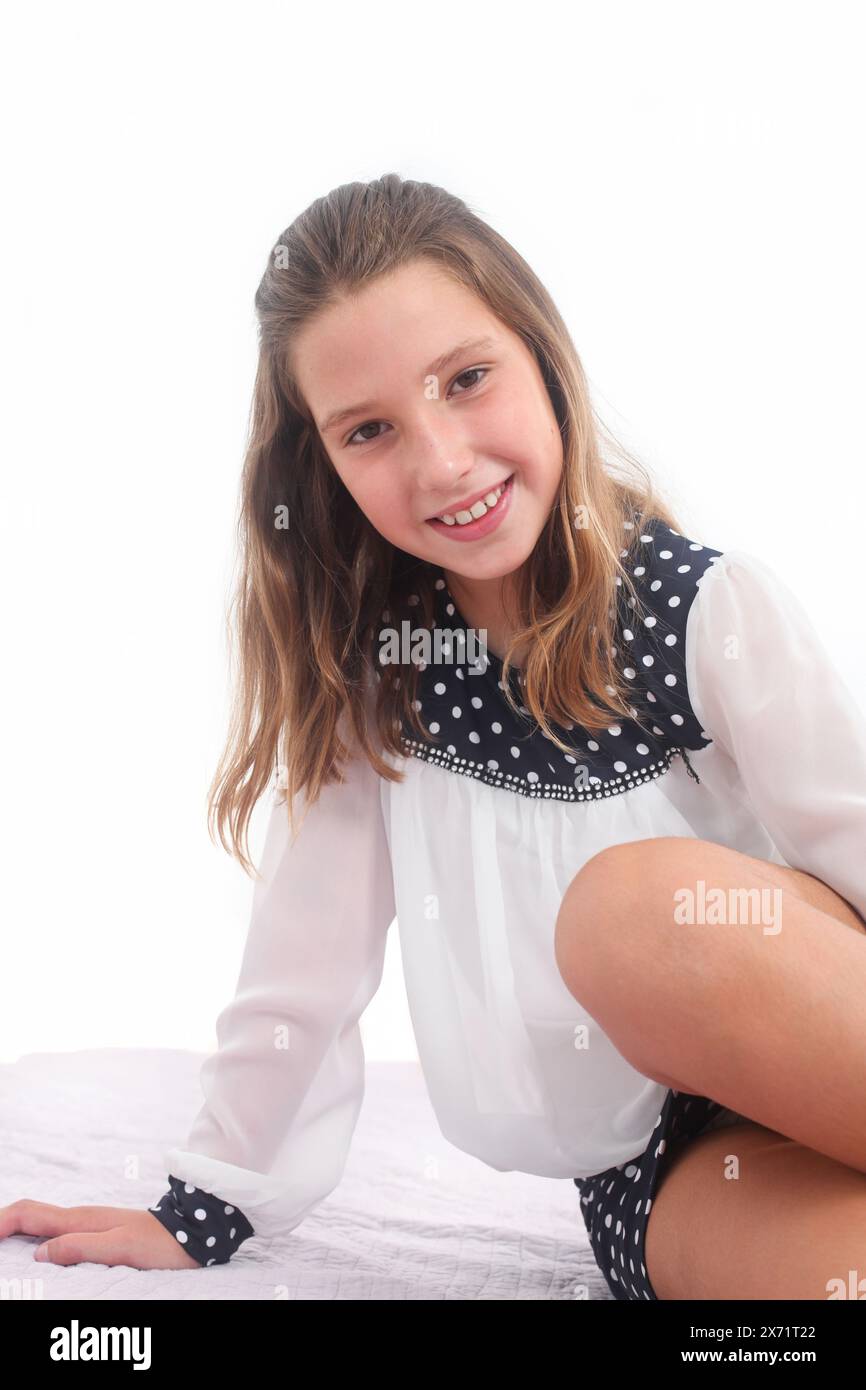 portrait of a cheerful preteen girl on white background Stock Photo - Alamy