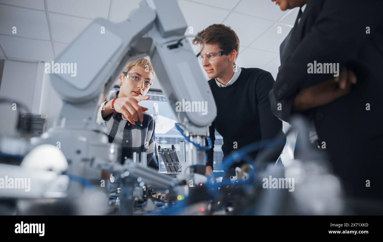 Two Concentrated Students Express their Ideas and Assumptions Standing ...