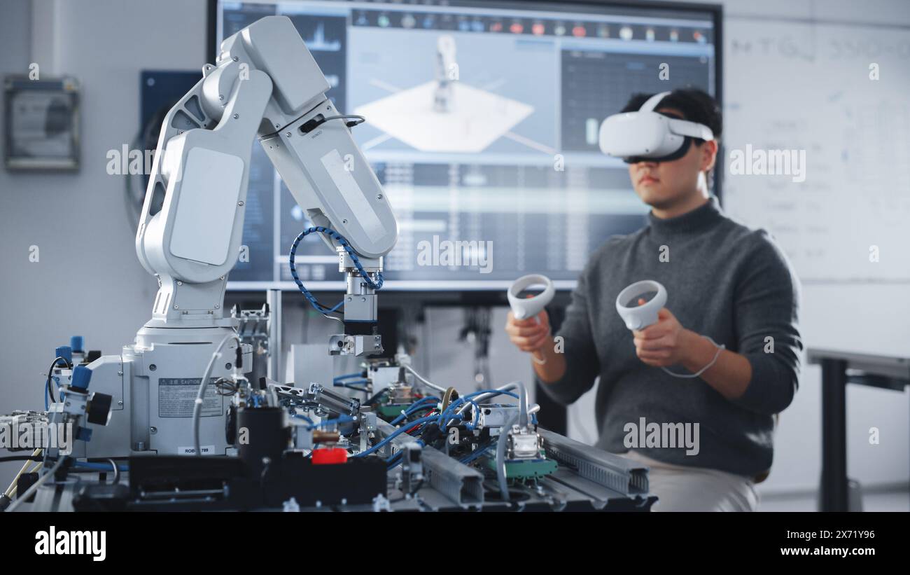 Asian Student Testing Interface of Bionic Hand. Engineer Wearing ...