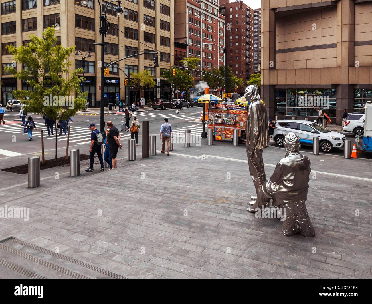 The Ninth Avenue plaza outside the Manhattan West development showing the artist Charles Ray’s “Adam and Eve” (2023) in New York on Thursday, May 9, 2024 (© Richard B. Levine) Stock Photo
