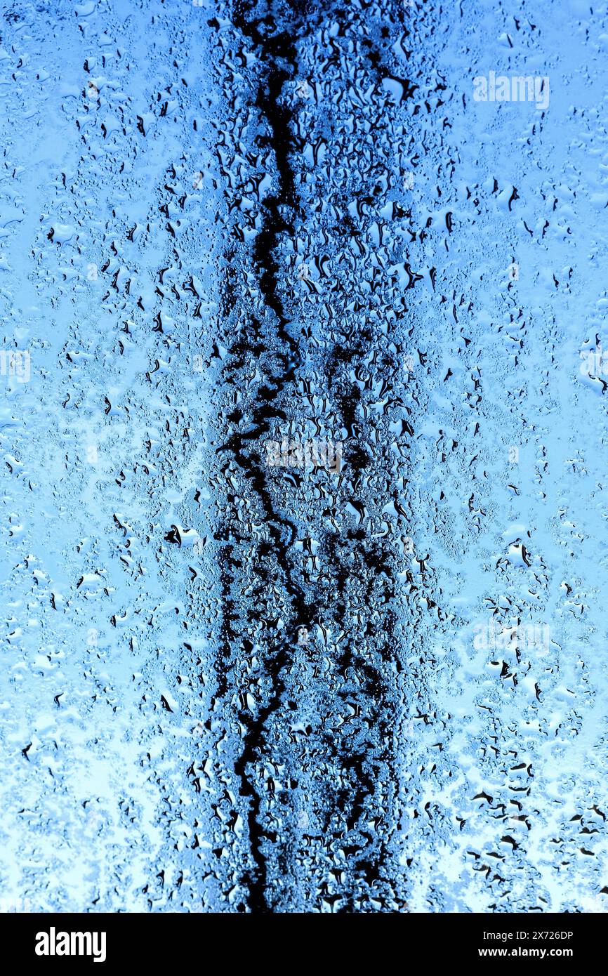 Early morning condensation and raindrops on Velux roof window Stock