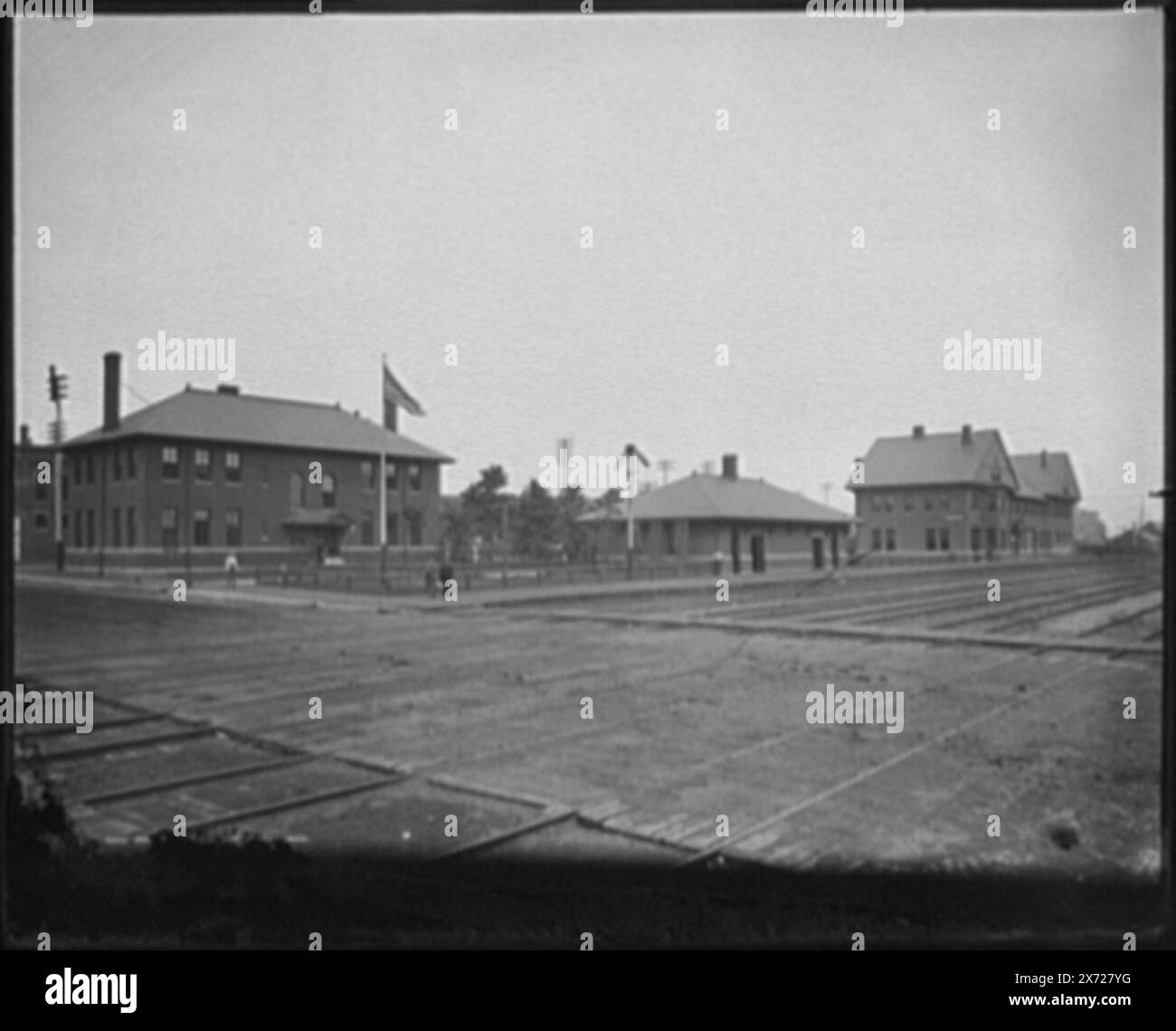 Railway station at Boone, Iowa, Detroit Publishing Co. no. 01943., Gift; State Historical Society of Colorado; 1949,  Railroad stations. , Railroad crossings. , United States, Iowa, Boone. Stock Photo