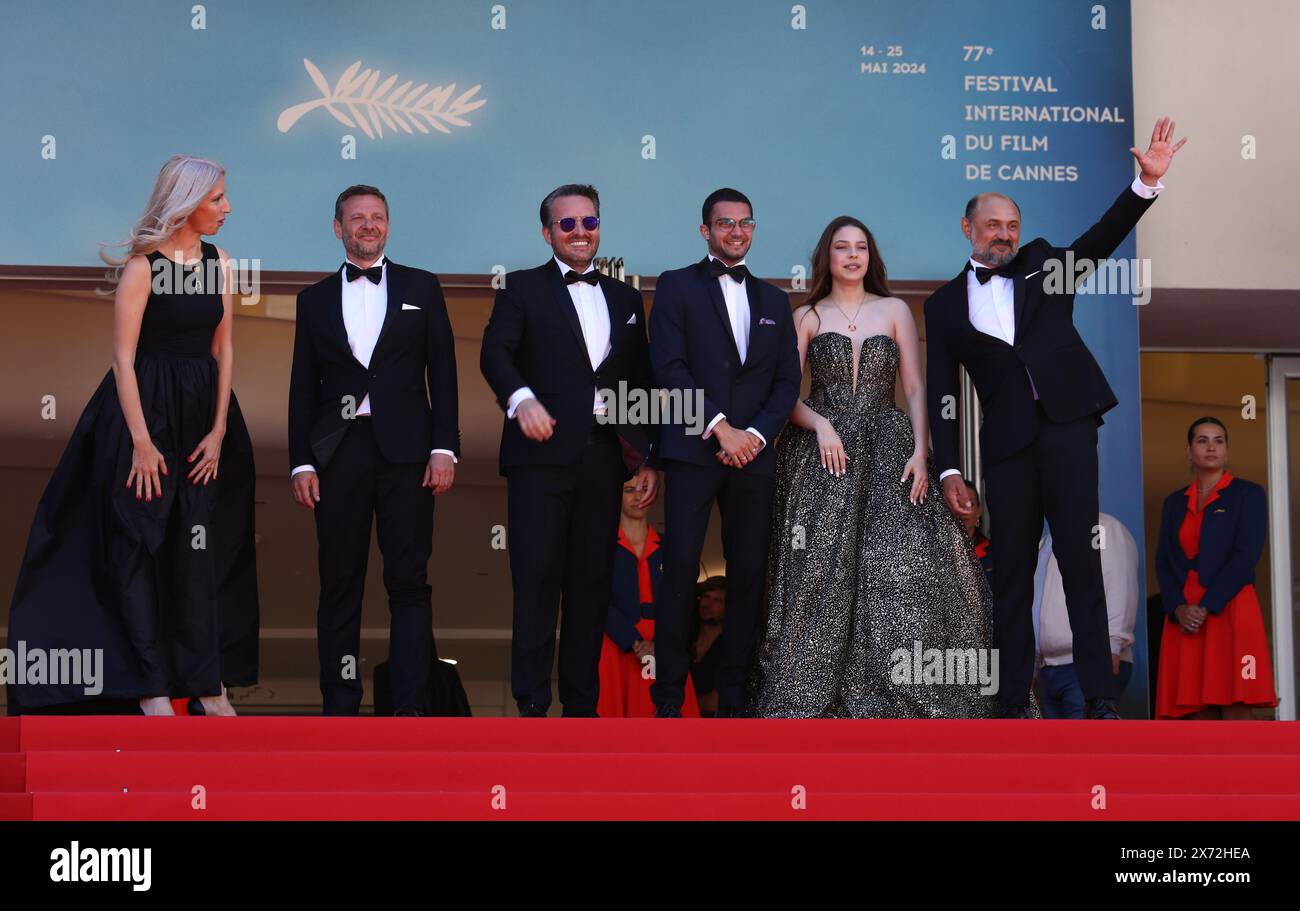 May 17, 2024, Cannes, Cote D'azur, France: Valeriu Andriuta, guests, Emanuel Parvu, Bogdan Dumitrache and guest attend. the 'Three Kilometers to the End of the World' Premiere screening at the 77th Annual Cannes Film Festival at Palais des Festivals in Cannes, France (Credit Image: © Mickael Chavet/ZUMA Press Wire) EDITORIAL USAGE ONLY! Not for Commercial USAGE! Stock Photo
