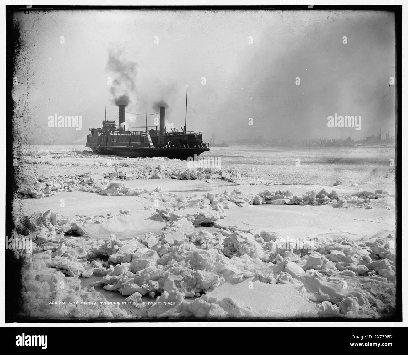 Car ferry turning in ice, Detroit River, Locale and date based on Detroit, Catalogue J (1901)., 'Mercury intensiey [sic]' on negative., Detroit Publishing Co. no. 05570., Gift; State Historical Society of Colorado; 1949,  Railroad cars. , Ferries. , Rivers. , Ice. , Winter. , United States, Michigan, Detroit River. , United States, Michigan, Detroit. Stock Photo