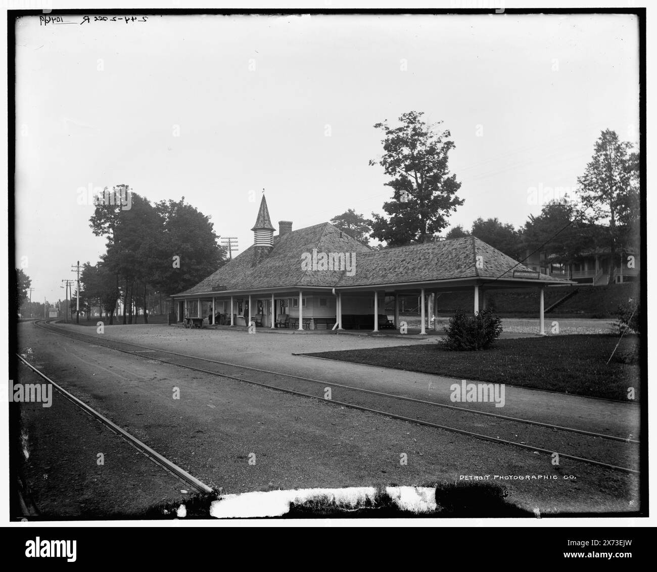 G.R. & I. Station at Bay View, Mich., Date based on Detroit, Catalogue J (1901)., Videodisc images are out of sequence; actual left to right order is 06099, 06098., '243-2 sec L' and '244-2 sec R' on negatives., Detroit Publishing Co. no. 010469., Gift; State Historical Society of Colorado; 1949,  Grand Rapids & Indiana Railway. , Railroads. , Railroad stations. , United States, Michigan, Bay View. Stock Photo